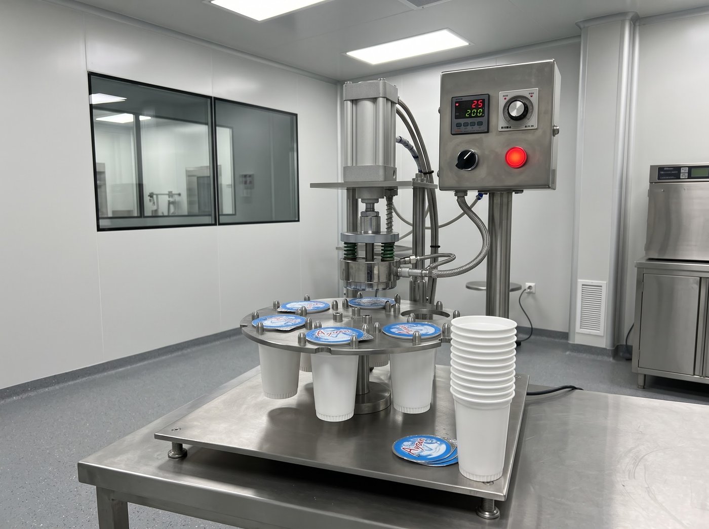 Rotary cup sealing machine